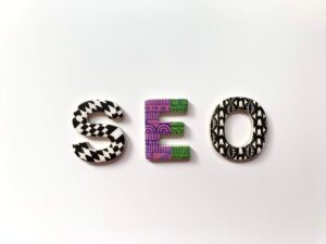 Colorful letters spelling "SEO" with various patterns, symbolizing search engine optimization for small businesses.